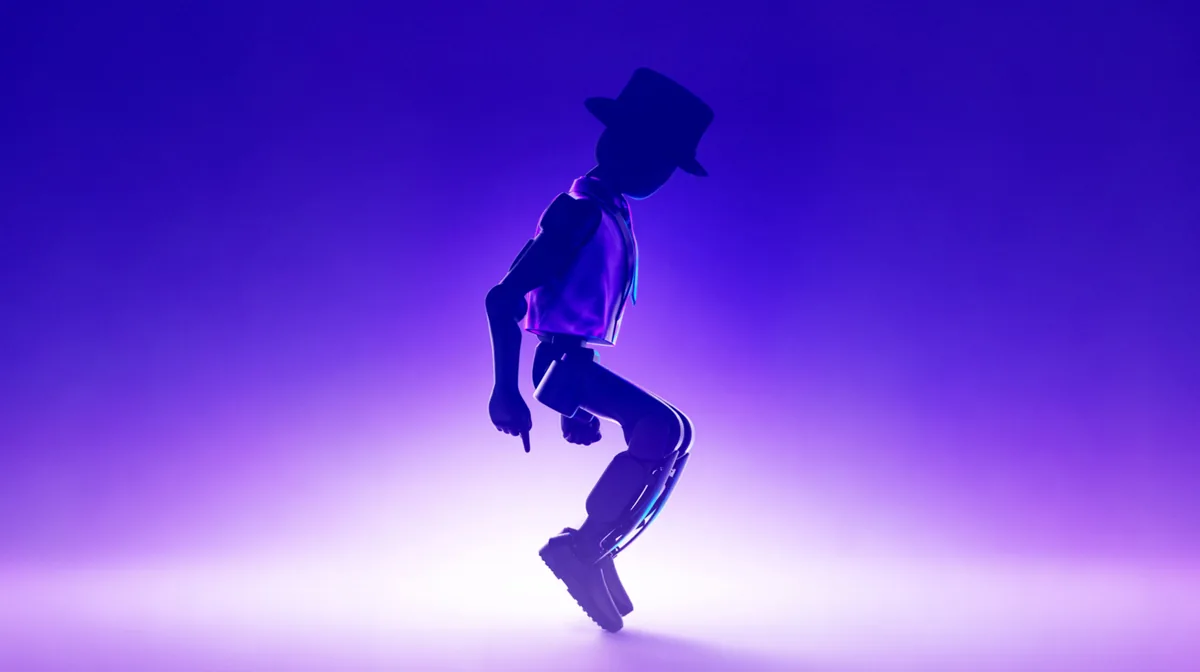 Compact humanoid robot dances under stage lighting at an event